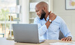 © Anela Ramba/peopleimages.com - Black man, shoulder pain on laptop in stress and injury suffering from overworking at home. Stressed African male holding sore muscle, tension or joint inflammation sitting with computer and work