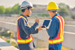 © Suriyo - Asian Engineer construction are worker employee working by safety control helmet on site building