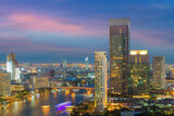Fototapeta Miasto - Bangkok city skyline. Landscape of building at Bangkok central business around the Chao Phraya river. Aerial view of Thailand modern building in business district area.