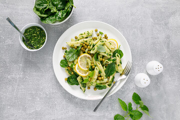 Canvas Print - Pasta penne with spinach pesto and green peas