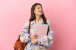 © luismolinero - Young student woman isolated on pink background laughing