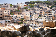 Houses Of An Old Arabian Village In Jerusalem, Israel With Blurred Stones On The Foreground