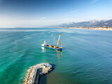 Fototapeta Miasta - Aerial view from the drone of a dredging vessel seabed