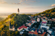 An aerial photo of watchtower Stramberska Truba while sunset golden hour in Stramberk in the Czech Republic. High quality photo