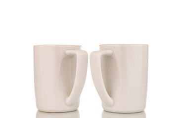 Canvas Print - Two white ceramic cups for coffee, close-up, isolated on a white background.