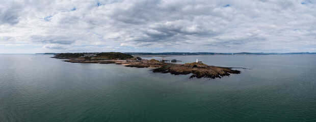 Poster - view of the Mumbles headland with the historic lighthouse and piers in Swansea Bay