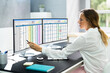 © Andrey Popov - Data Analyst Woman Using Spreadsheet