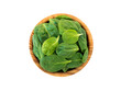 Spinach leaves in the olive wood bowl top view isolated transparent png. Green vegetable flay lay.