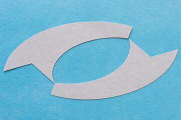 two 2d paper ribbons with tails on blue felt