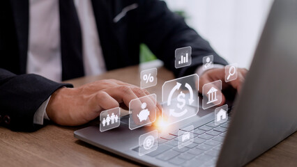 Businessman using a computer to Concept of fund financial investment management portfolio diversification