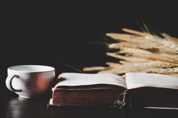 Wall Mural - Holy bible book with paper for education on black wooden background. Christian catholic with protestant worship and pray in church. Concept of learning about faith god and religion, jesus spiritual.