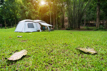 Camping Cabin Tent On Grass Campground And Tree In Nature Green Forest And Autumn Camp To Holiday Relax Or Vacation Travel Trip With Family Trekking On Lawn And Morning Sunlight At Pha Tad Waterfall