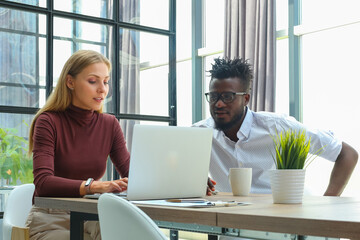 Two collegues discussing documents and other working moments in office.