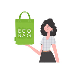 Wall Mural - A woman holds an ECO BAG in her hands. Concept of green world and ecology.   Trend style. .