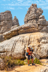 A young father with his son enjoying the Torcal de Antequera on the green and yellow trail, Malaga