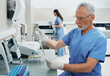 © Peakstock - Laboratory technicians working in medical laboratory and researching on blood samples using modern technology