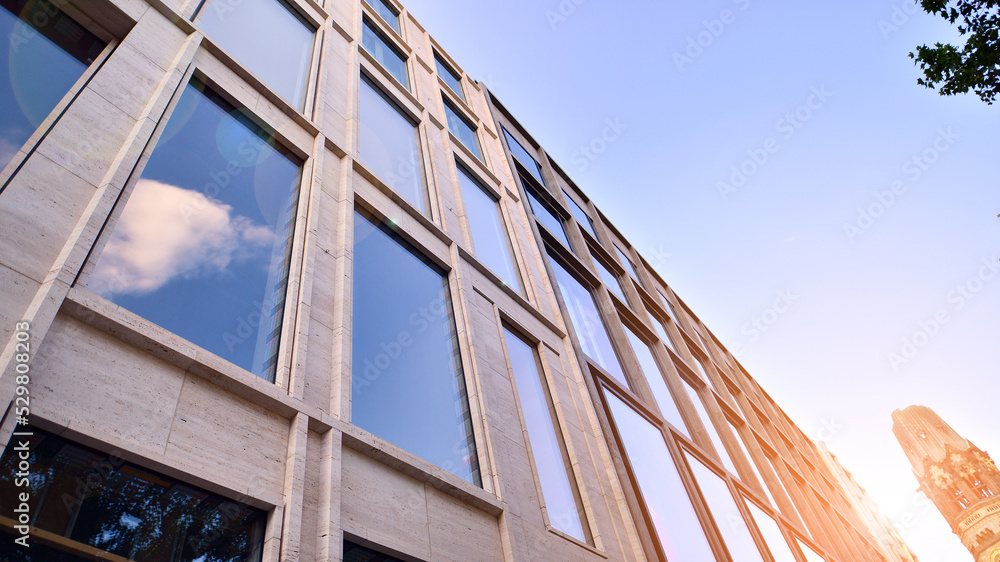 Abstract closeup of the glass-clad facade of a modern building covered ...