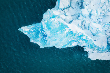 Wall Mural - Iceland. An aerial view of an iceberg. Winter landscape from a drone. Jokulsarlon Iceberg Lagoon. Vatnajokull National Park, Iceland. Traveling along the Golden Ring in Iceland.