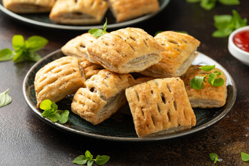 Wall Mural - Mini beef patties with vegetables and red wine wrapped in puff pastry
