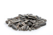 Sunflower seeds accumulation on white background, cropped image