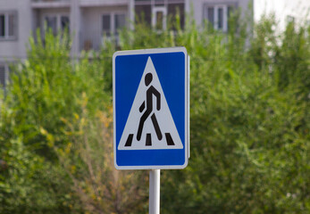 Wall Mural - Pedestrian triangle road sign blue background