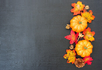  Autumn background with pumpkins and orange leaves