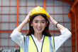 © BritCats Studio - Selective focus at young women inspector wearing safety equipment with smile confident. While doing audit for quality and safety control inside of factory area. Industrial protective gear. concept