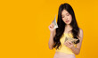 © Nutlegal - Rich woman count money dollars Pretty girl earn a lot of money Asian girl hold dollar, note bank or US money Portrait beautiful young asia lady with a lot of money and cash Rich and wealth concept