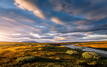 Incredible Iceland Nature Landscape During Sunset. Scenic Image Of Iceland With Grassy Meadow And Vivid Sky On Background. Iceland Is A Counry Of Stunning Natura Landscape And Travel Dectinations.