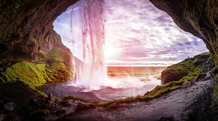Leinwandbilder - Incredible nature scenery of Iceland. Stunning view from the middle of  Seljalandsfoss waterfall under vivid sunlight. Fantastic landscape of Wild nature. Iceland Is  most popular travel destination.