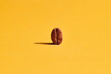 Roasted Coffee Beans On Yellow Background