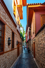 Beautiful narrow winding alleys of the old city (Kaleici) in Antalya (Turkey) on a summer day