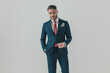 © Viorel Sima - confident elegant man in suit posing with his hand in pocket