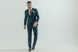 © Viorel Sima - full body picture of elegant businessman in suit walking