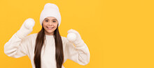 Happy Child In Winter Hat And Gloves Hold Snowballs On Yellow Background. Banner Of Christmas Child Girl, Studio Kid Winter Portrait With Copy Space.