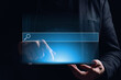 © gesrey - Holographic display with a search bar above the tablet in the hands of a person