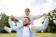 © Julija - Happy father and child having fun playing in park. Smiling young dad and daughter spending time together in nature. Family time, relationships concept.