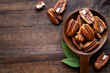 Shelled Pecan Nuts In A Wooden Spoon Bowl