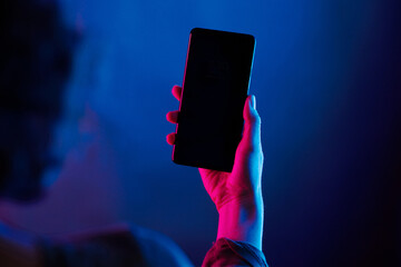 night life mobile phone over the shoulder