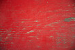 © Tiffany - close up of old red painted board with flaking weathered paint and exposed wood grain