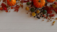 Harvest Background Including Pumpkins, Pine Cones, Autumn Leaves And Fruits.