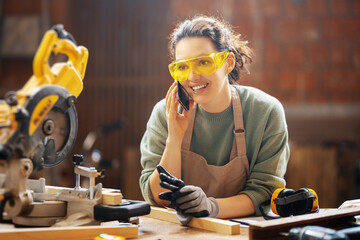 Wall Mural - woman carpenter in workshop