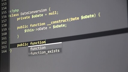 Wall Mural - typing php-code on screen by web developer and php developer shows computer screen with source code 