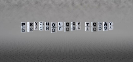 Sticker - psychology today word or concept represented by black and white letter cubes on a grey horizon background stretching to infinity