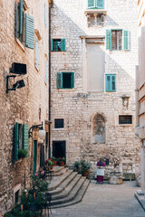 Wall Mural - Old stone historic buildings of Sibenik, Croatia. Traditional Dalmatian old town architecture. Summer travel vacation concept