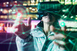 © Westend61 - Woman wearing VR glasses experiencing immersive cyberspace