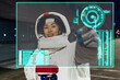 © Westend61 - Young woman wearing astronaut costume touching device screen