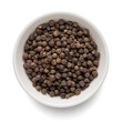 Black pepper in white bowl isolated on white. Top view.