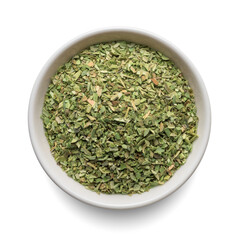 Dried oregano seasoning in round bowl isolated on white. Top view.