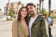 © Krakenimages.com - Man and woman smiling confident hugging each other at street